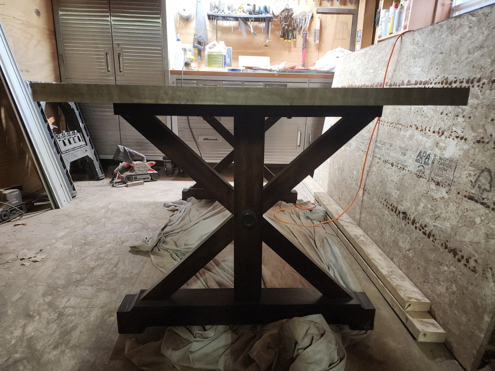 Blackened X-frame trestle base built for the dining table